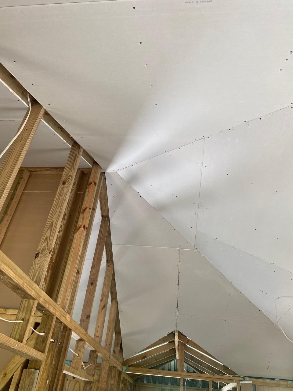 Drywall fitted around cathedral ceiling angles