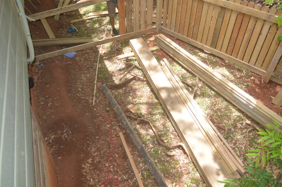 Lumber staged for fence construction